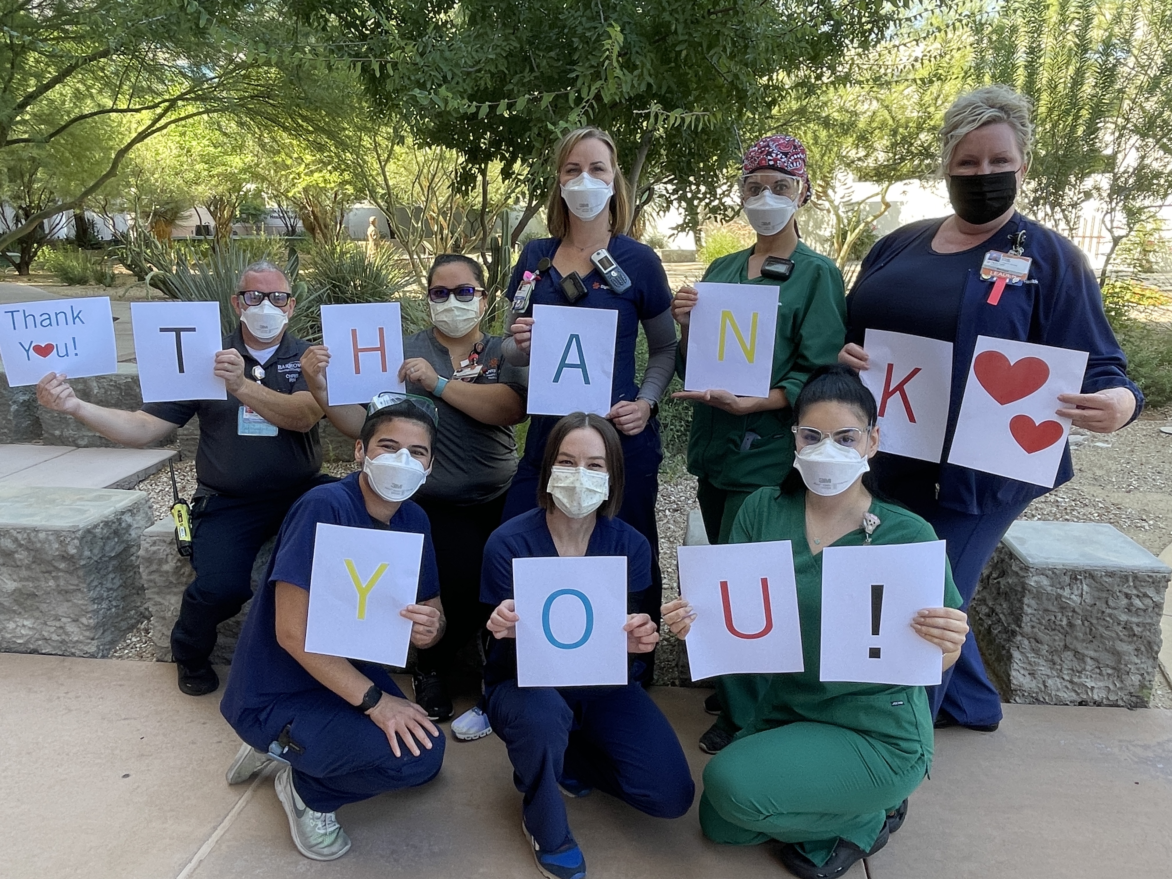 nurses holding thank you sign
