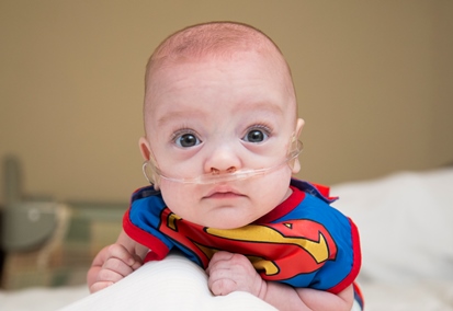 Baby Victor Duarte in Superman bib