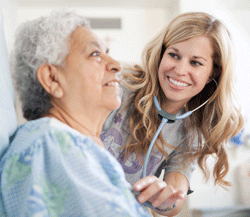 Nurse with patient at St. Joseph's.