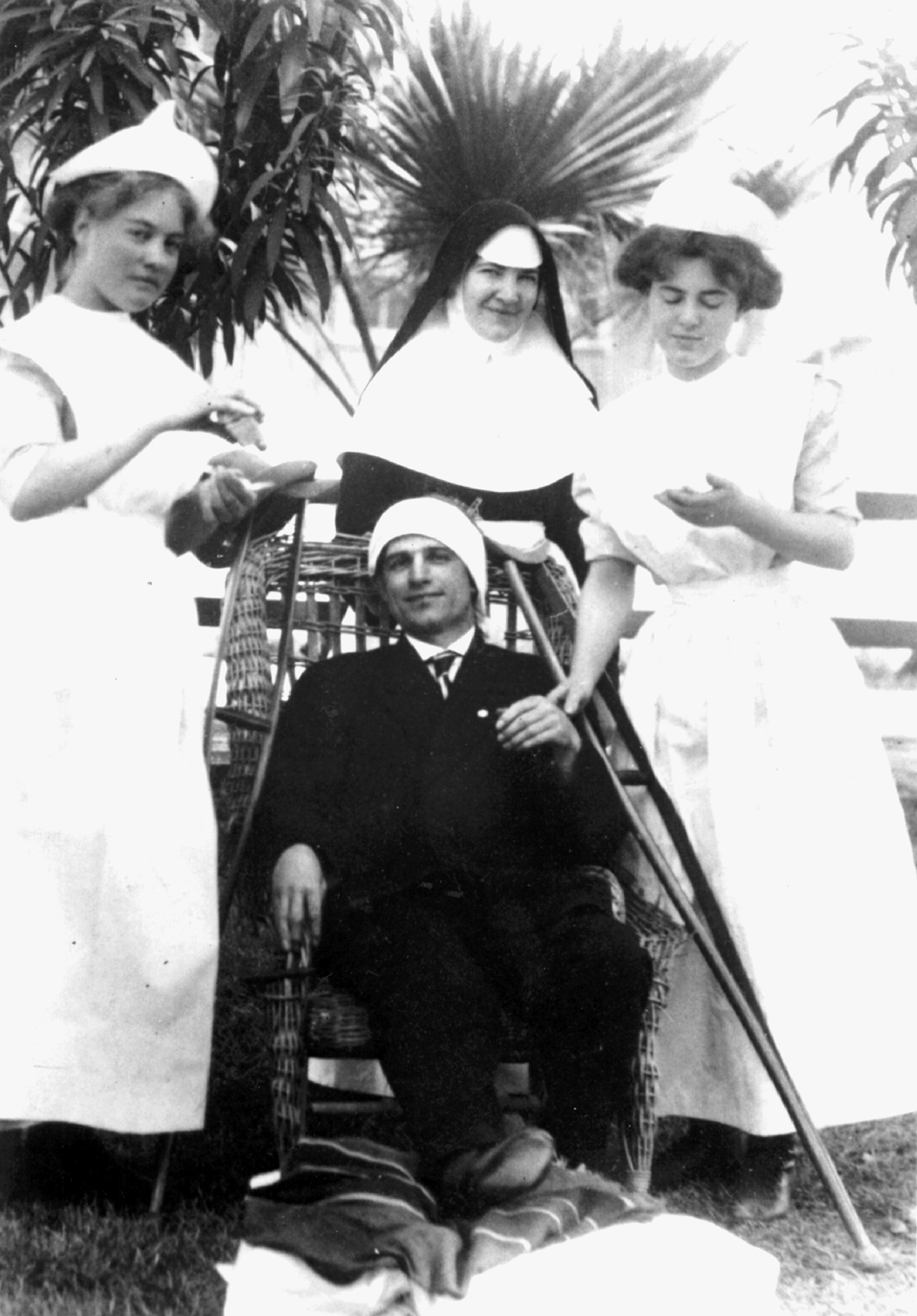 historical photo of Sisters treating a patient