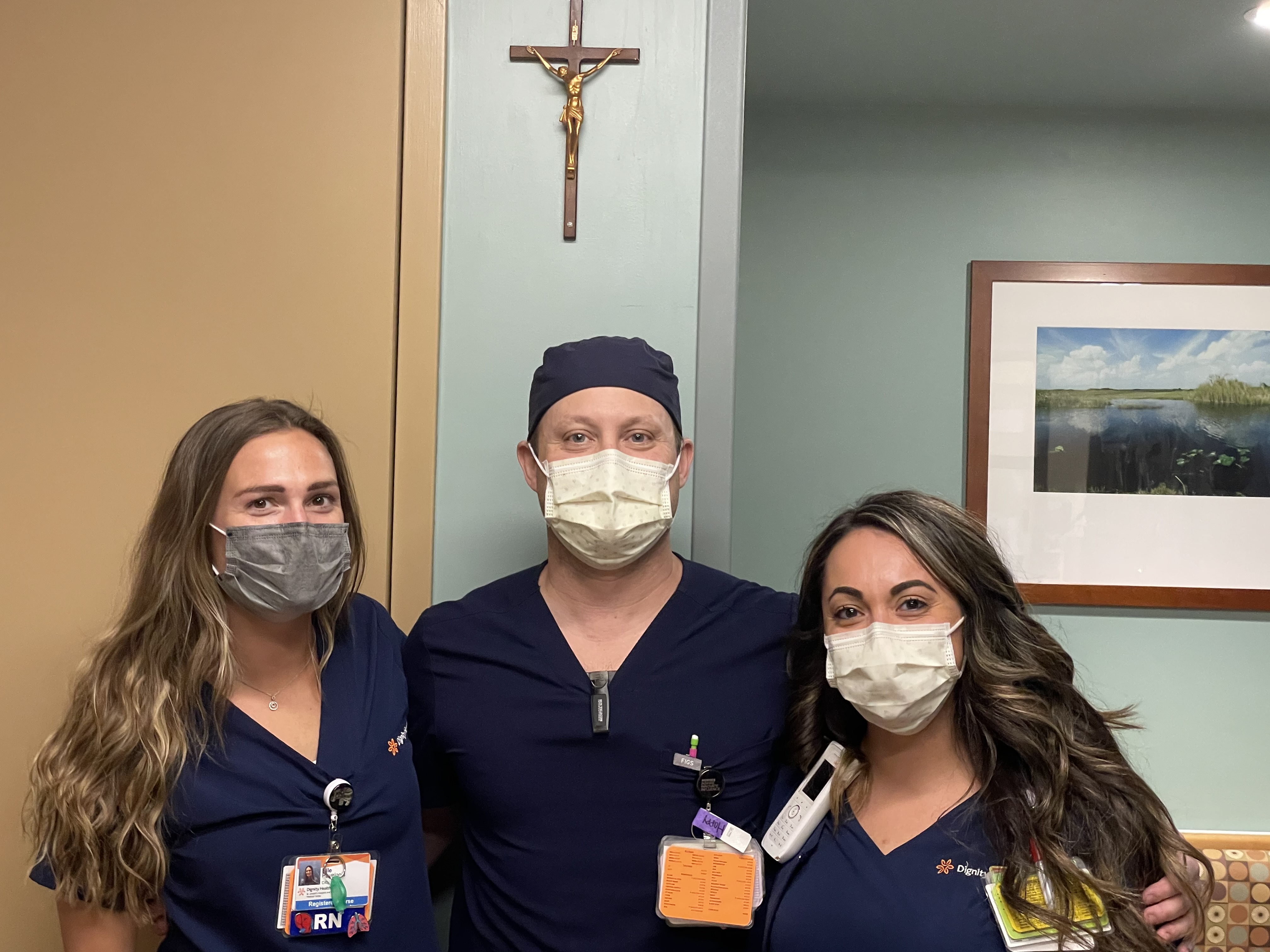 3 nurses under a mercy cross