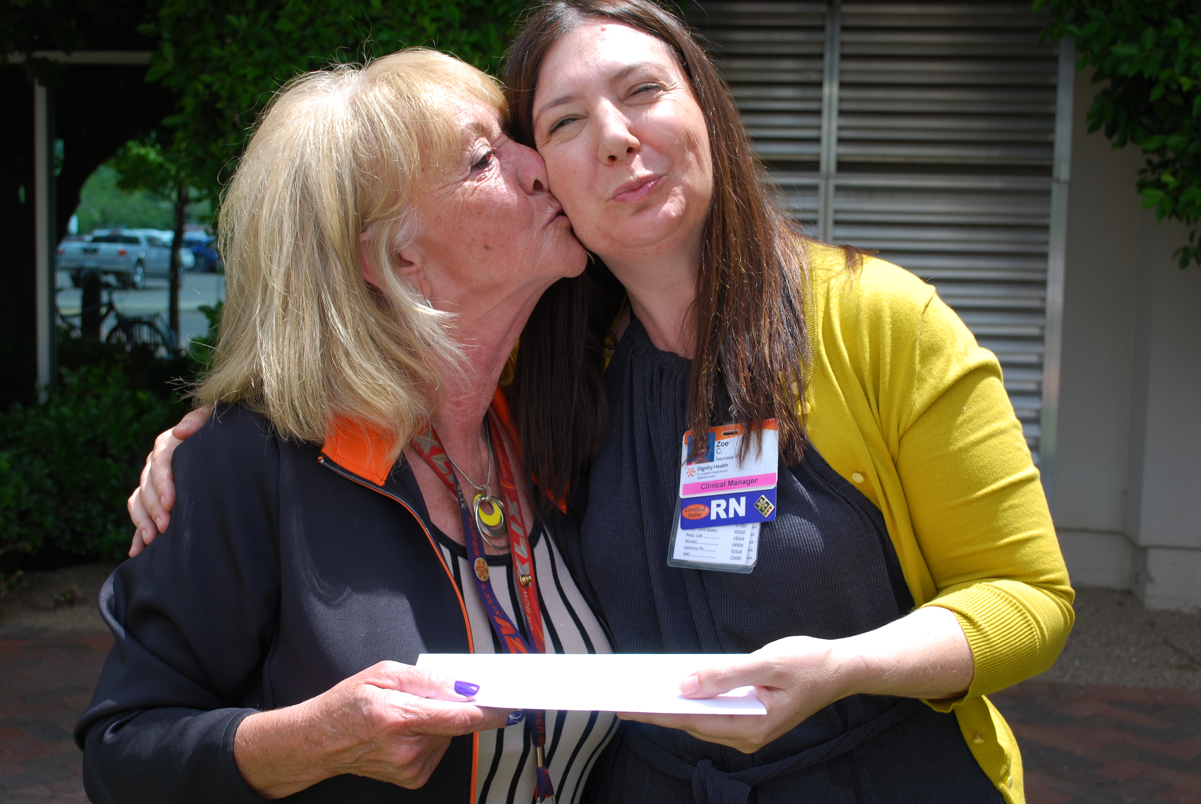 Marilyn Ehlebracht presents check to Zoe Coleman
