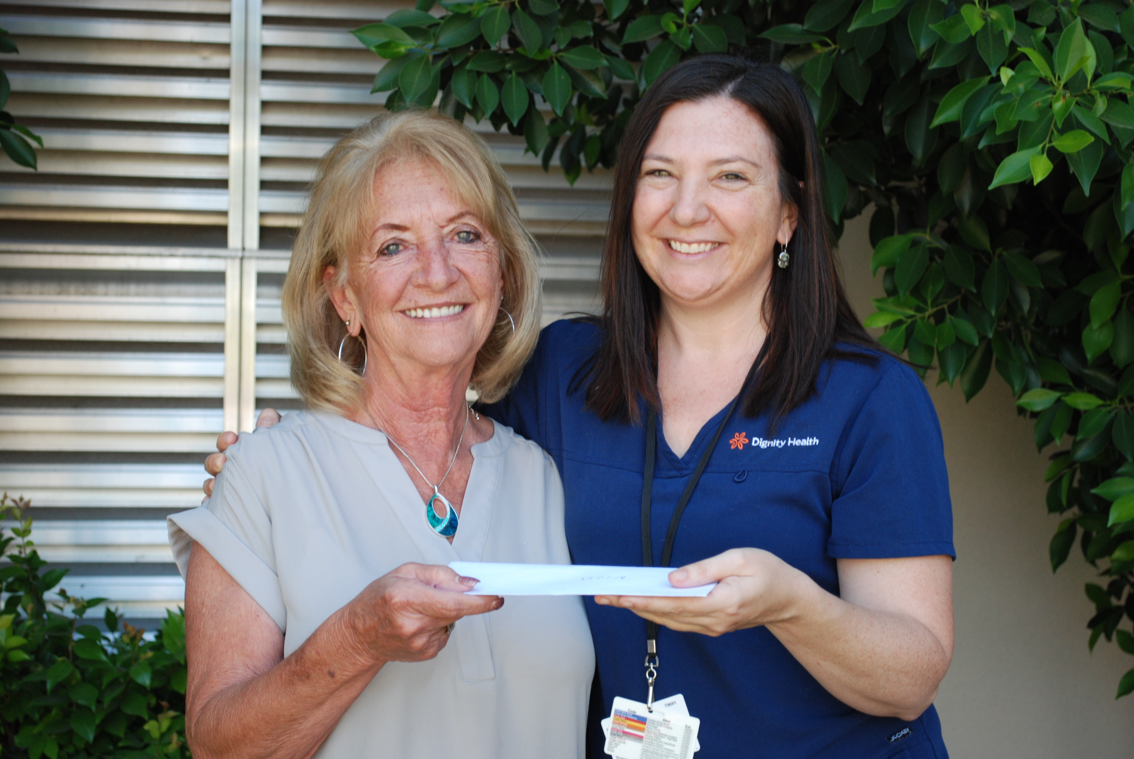 Marilyn Ehlebracht presents check to Zoe Coleman