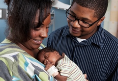 Mom holding premature baby 