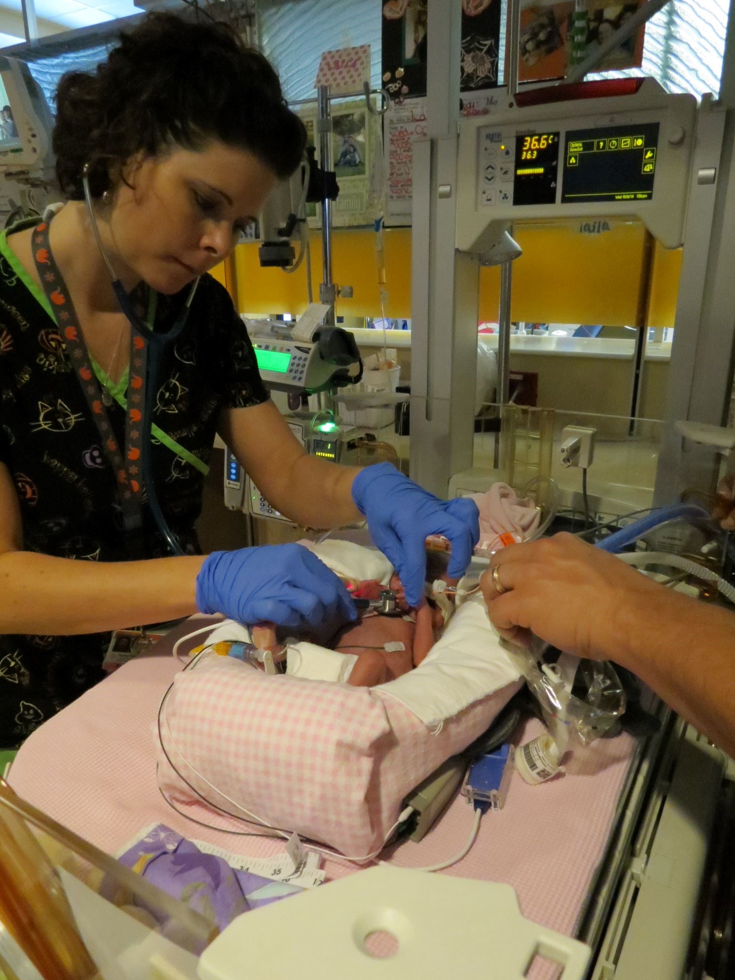 Nurse treating preemie