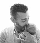 Mike Reuscher with infant son