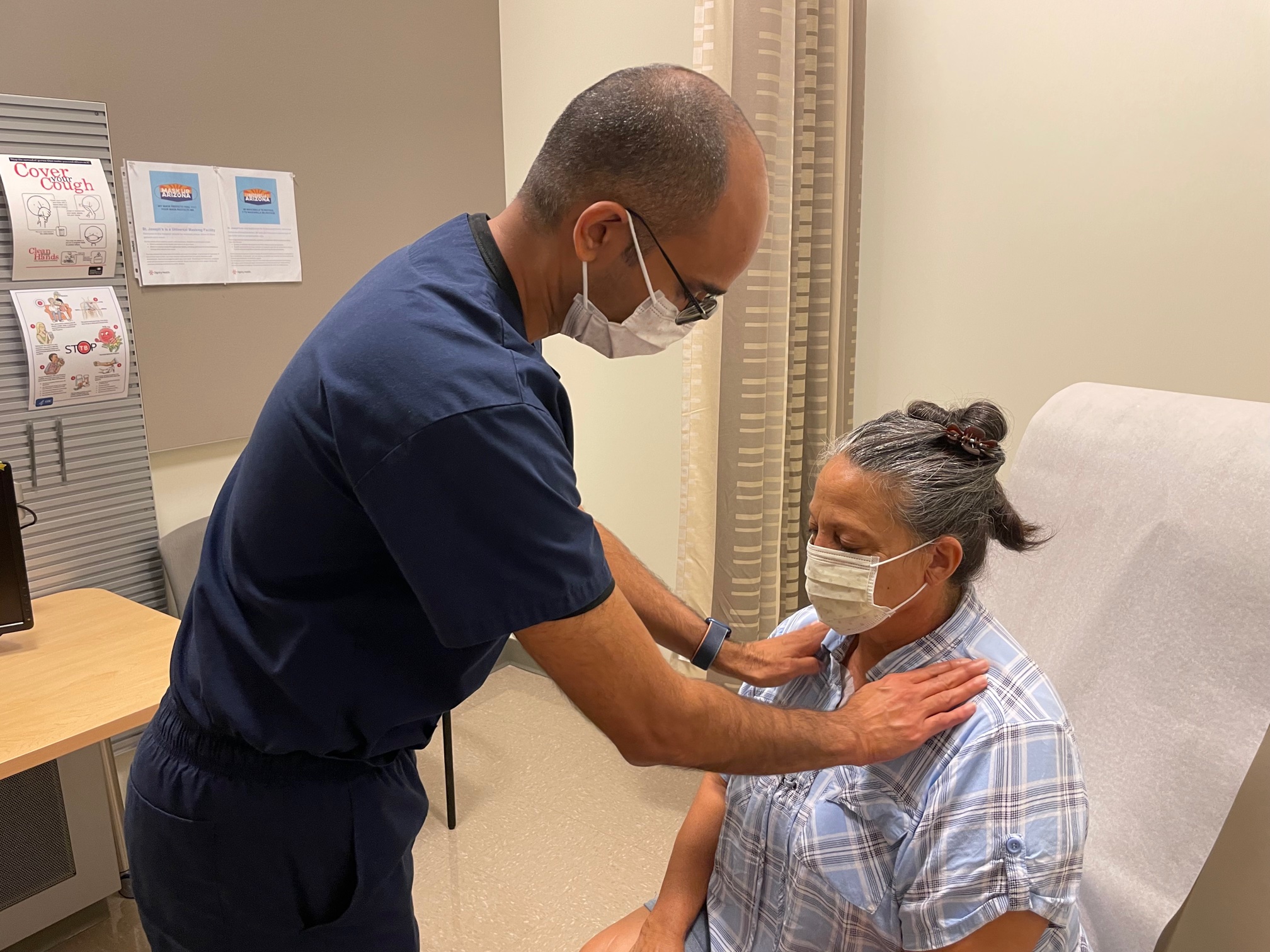 Dr. Torri examines patient