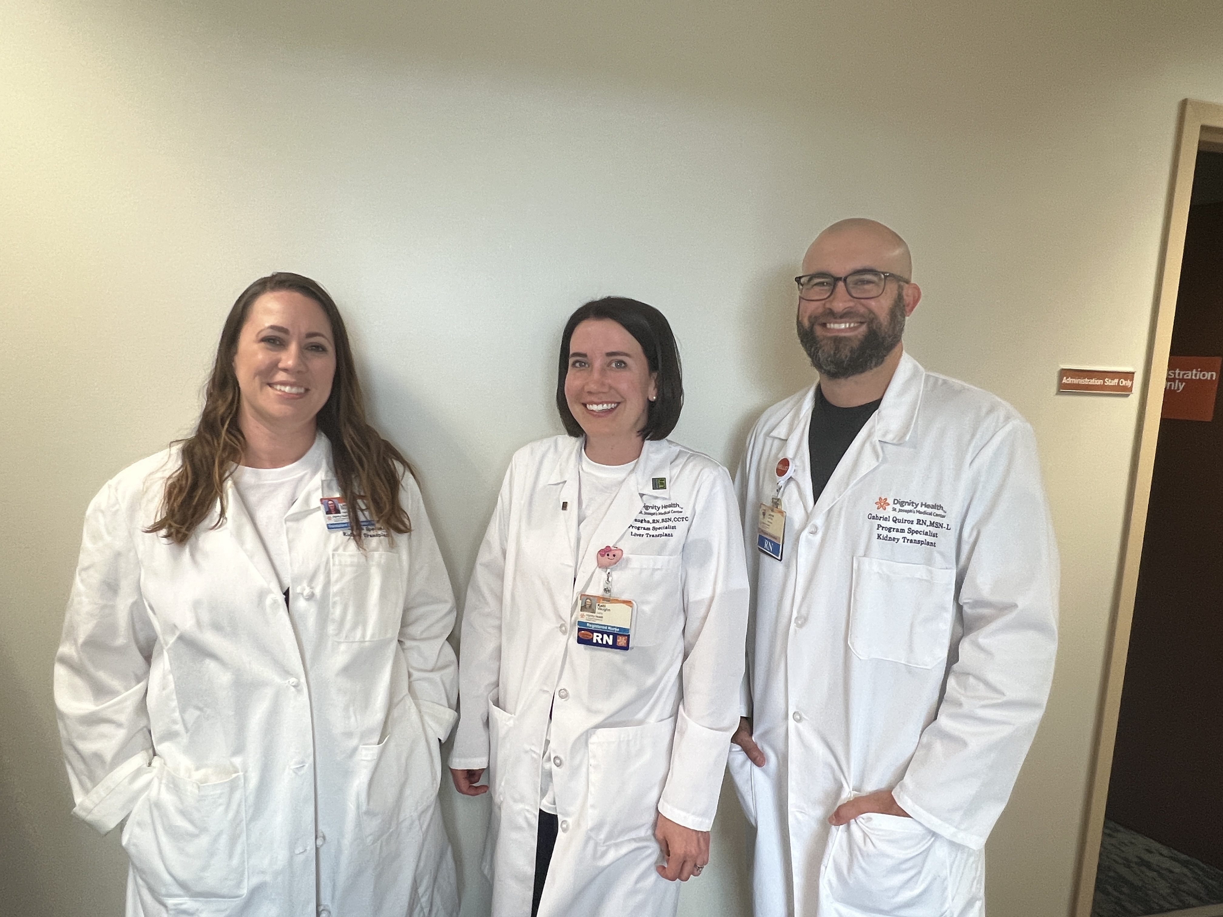three nurses outside patient room