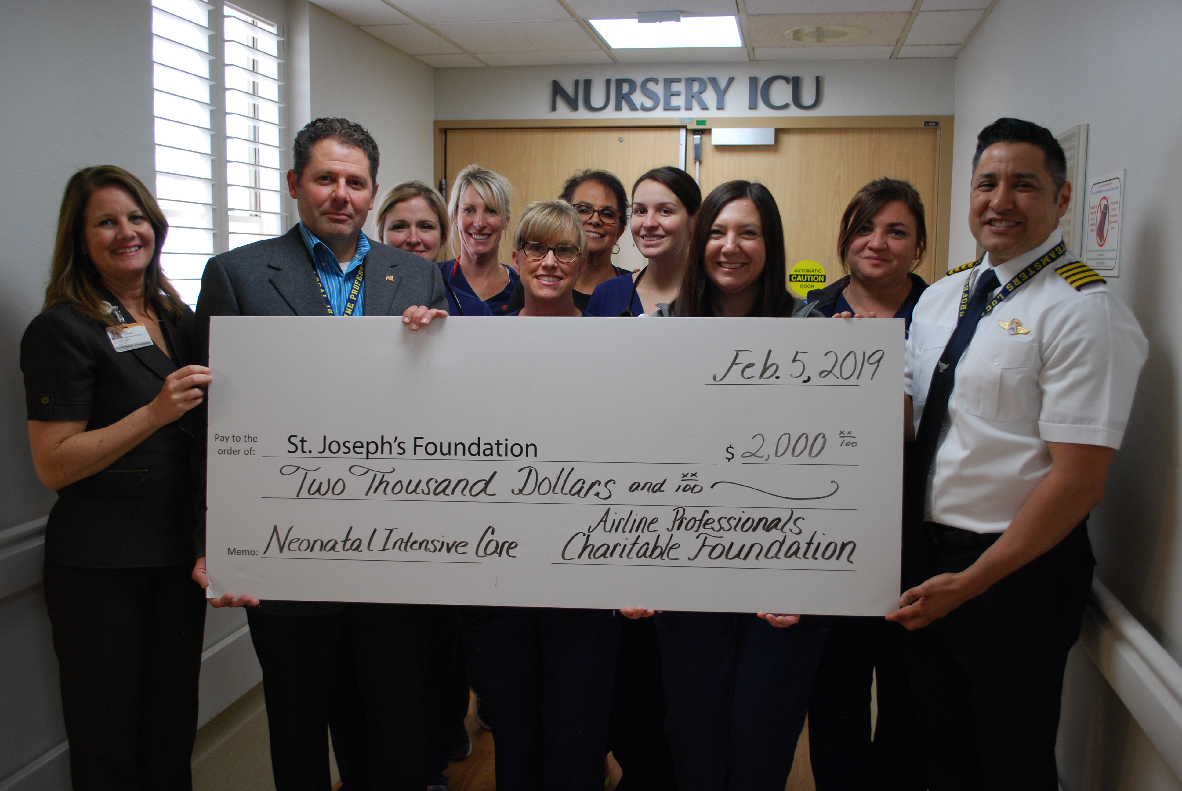 NICU nurses gather for check presentation