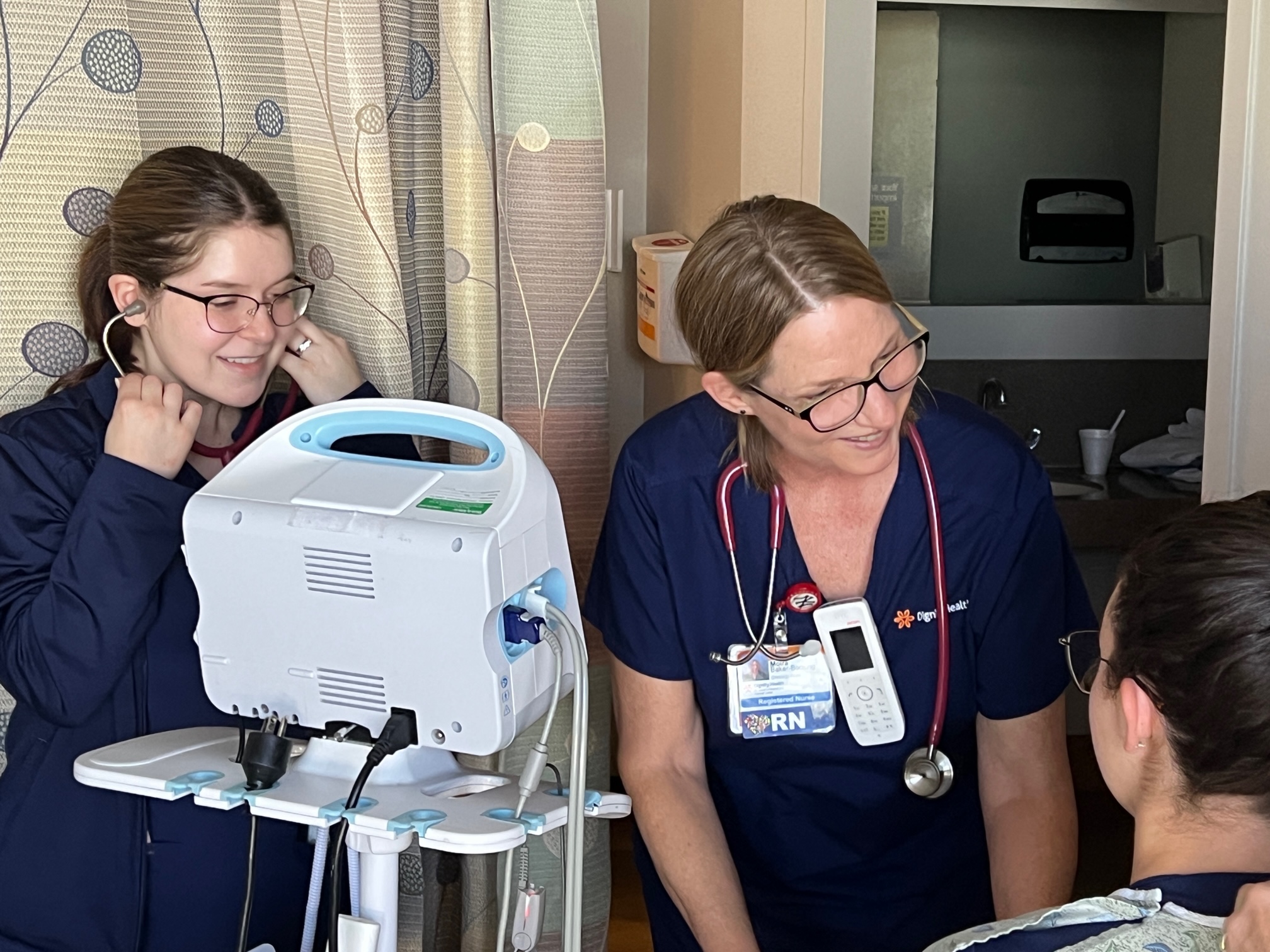 nurses caring for a patient
